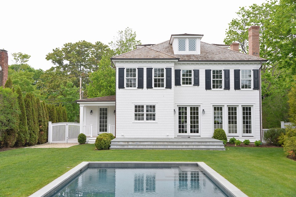 rear view of the federal style classic in keeping with the summer houses of the 18th and 19th century, the architectural details and design make this house look like it has been here forever!