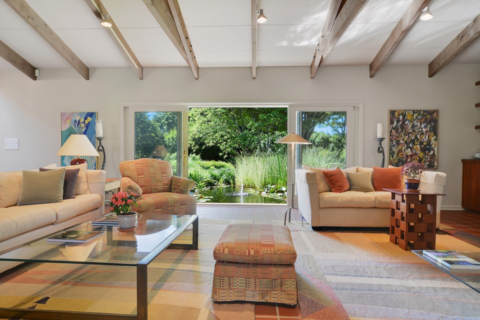 living room opening to the lily pond and its fountain