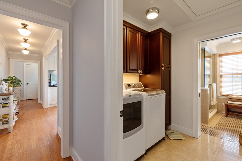 here is the bathroom with storage and a laundry room as well