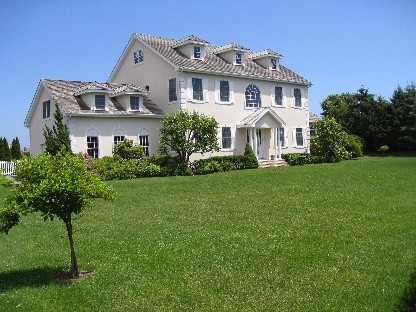 classic stucco in southampton village private community this two and one half story traditional is a pond-front marvel. perfect for summer respites and gatherings, this 5 bedroom home has a fireplace, main floor master suite, heated pool and tennis!! what more could you want for a fabulous summer get-away?