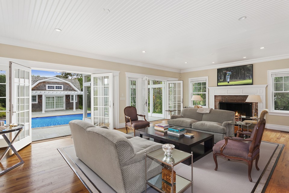 family room opens to the screened-in porch and the pool area