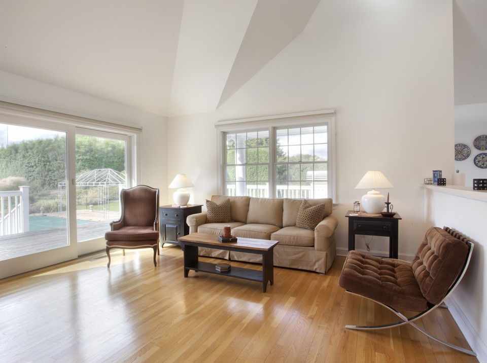 a den or dining area the seating arrangement can be a dining table and chairs instead.