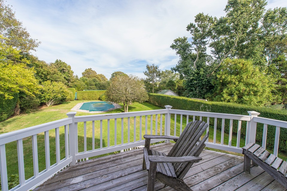 upstairs master balcony overlooking the pool and tennis court